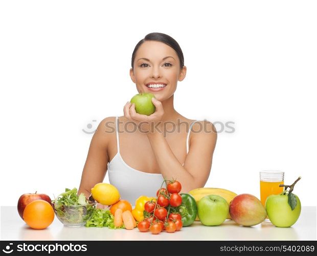 healthy woman with lot of fruits and vegetables in front