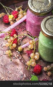 Healthy yogurt with raspberries. Raspberry yogurt in raspberry and currant berries in a glass jar