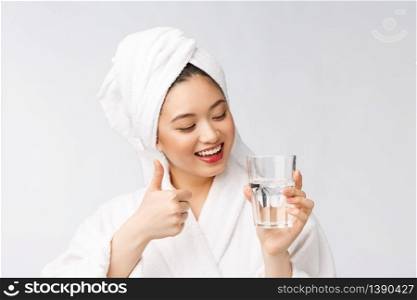 Healthy young beautiful woman drinking water, beauty face natural makeup, isolated over white background. Healthy young beautiful woman drinking water, beauty face natural makeup, isolated over white background.