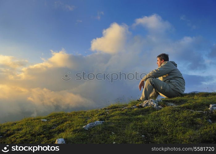 healthy young man practice yoga in height mountain at early morning and sunrise