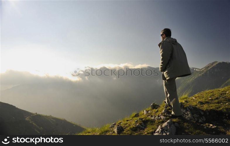 healthy young man practice youga in height mountain at early morning and sunrise
