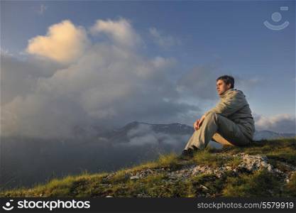 healthy young man practice youga in height mountain at early morning and sunrise