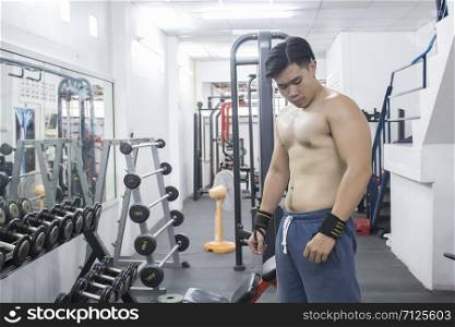 Healthy Young Man Standing Strong In The Gym