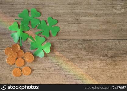 heap coins green paper clovers board