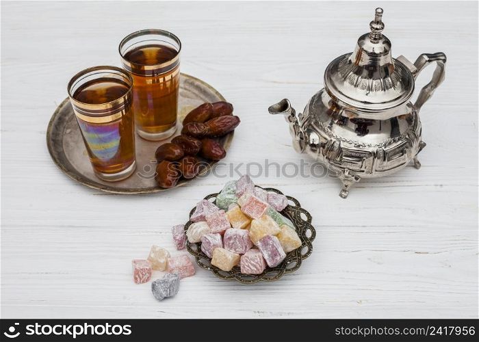 heap dry dates near cups tea turkish delights teapot