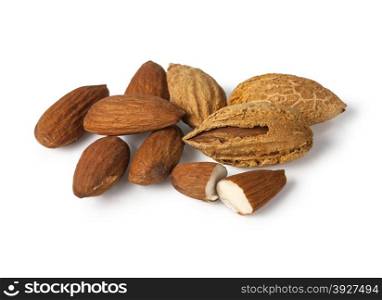 Heap of almond nuts in shell isolated on white with clipping path
