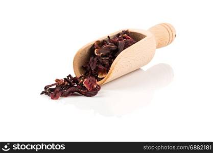 Heap of aromatic Hibiscus tea (karkade) in spoon, isolated on white background