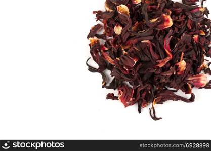 Heap of aromatic Hibiscus tea (karkade), isolated on white background