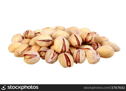 Heap of beige pistachio nuts isolated on white background. Close-up. Studio photography.