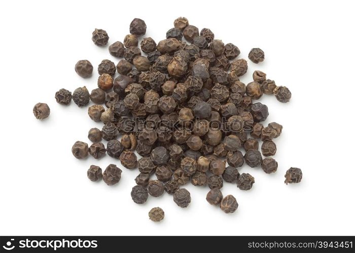 Heap of black peppercorns on white background