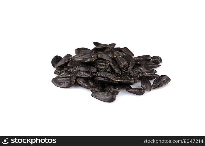Heap of black sunflower seeds isolated on a white background