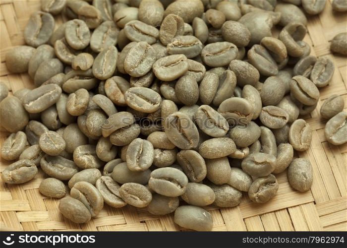 Heap of Bolivian Yanaloma green unroasted coffee beans close up