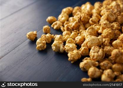 Heap of Caramel Corn Background on blue rustic table