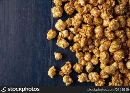 Heap of Caramel Corn Background on blue rustic table