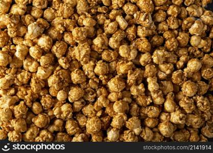 Heap of Caramel Popcorn Background. Close up
