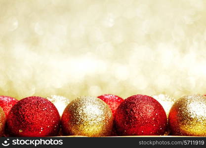 Heap of Christmas balls on golden background