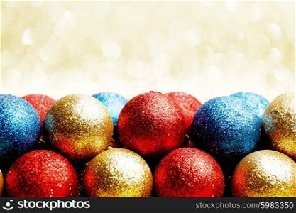 Heap of Christmas balls on golden background