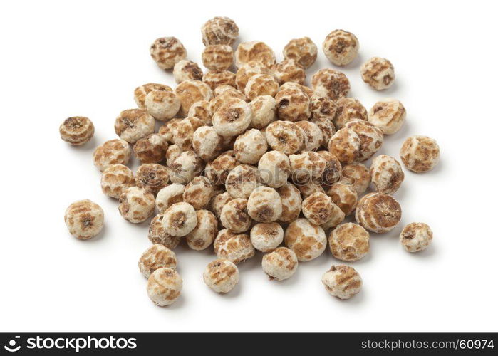 Heap of Chufa nuts on white background