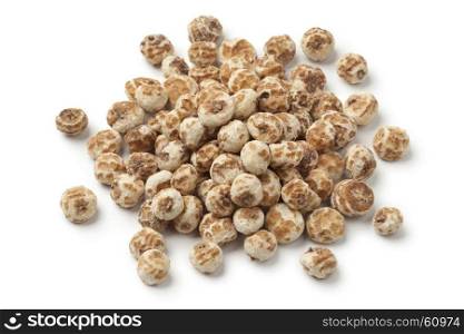 Heap of Chufa nuts on white background