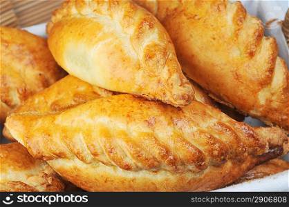heap of delicious fresh pies with meat