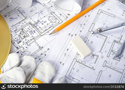 heap of design and project drawings on table background.