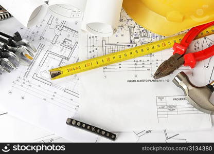 heap of design and project drawings on table background.