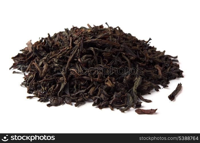 Heap of dred black tea leave isolated on white