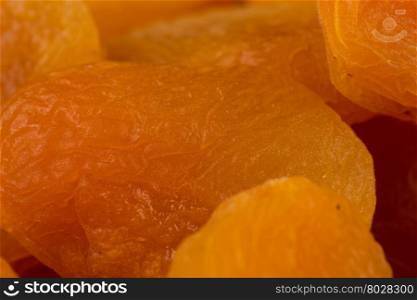 Heap of dried apricots macro close-up shot