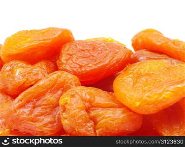 heap of dried apricots over white