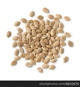 Heap of dried pumpkin seeds on white background