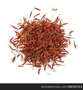 Heap of dried safflower leaves, substitute for saffron, close up isolated on white background    