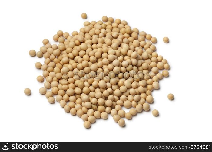 Heap of dried soybeans on white background