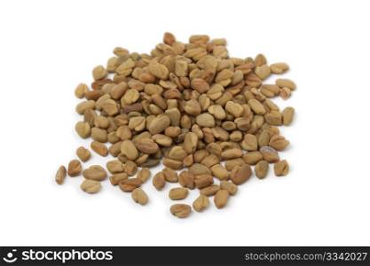 Heap of Fenugreek seeds on white background