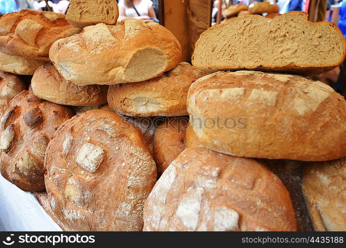 Heap of fresh baked buns on trading tray