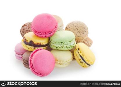 Heap of fresh macaroons isolated over white background