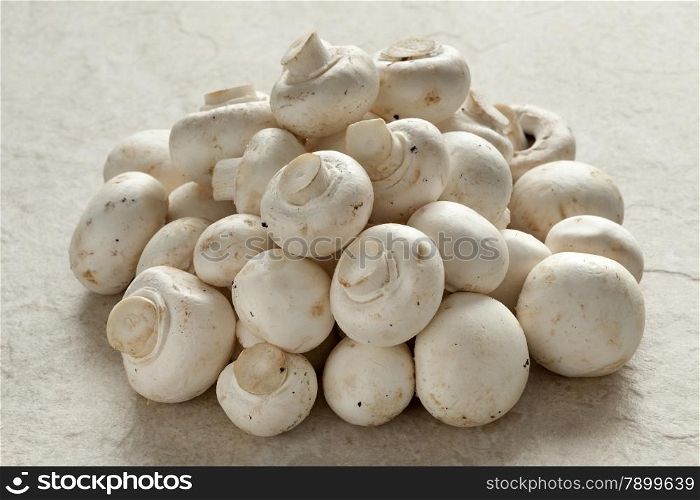 Heap of fresh raw button mushrooms