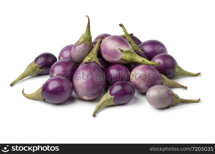 Heap of fresh raw purple mini eggplants isolated on white background