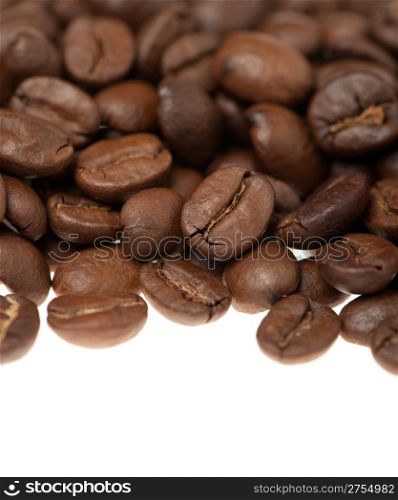 Heap of grains of coffee. It is isolated on a white background