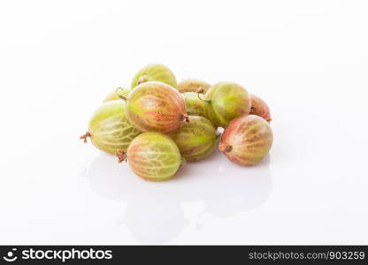 heap of green gooseberries isolated on white background