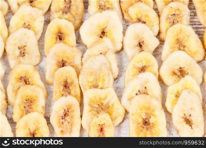 Heap of homemade chips of banana for snack or dessert. Homemade chips of banana for snack or dessert