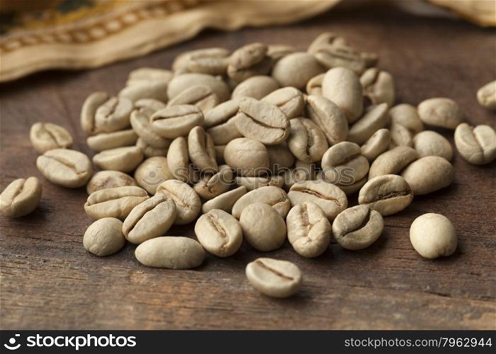 Heap of Indian Malabar green unroasted coffee beans