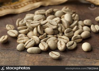 Heap of Indian Malabar green unroasted coffee beans