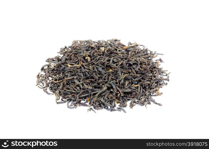 Heap of loose black tea Assam isolated on white background