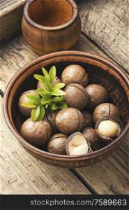 Heap of macadamia nuts in bowl.Healthy product. Macro photo macadamia nuts
