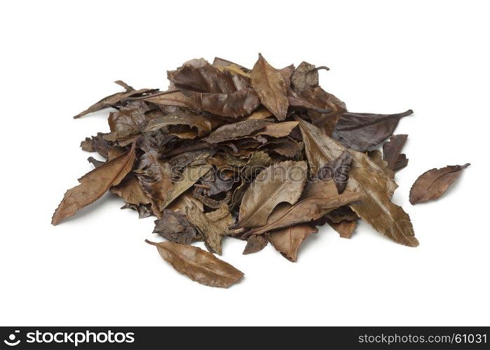 Heap of mountain tea leaves of the Meiji, Japanese old style tea, on white background