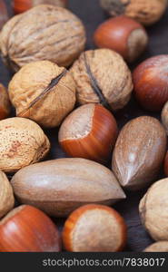 heap of nuts on a wooden surface