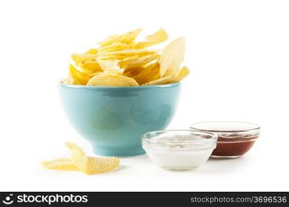 heap of potato crisps and ketchup and mayonnaise on white background
