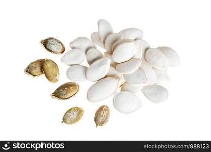 Heap of pumpkin seeds and cracked seeds isolated on white background