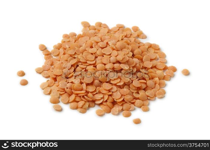 Heap of red lentils on white background