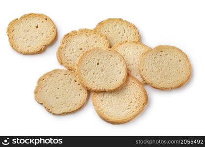 Heap of round melba toast isolated on white background